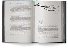 an open book with a tree branch on it's cover and the word w is written