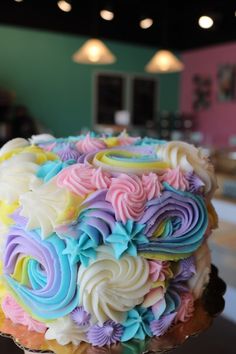 a colorful cake sitting on top of a table