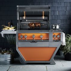 an outdoor bbq grill with food cooking on it's burners and shelves