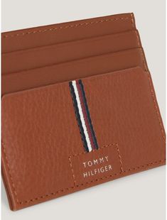 Tommy Hilfiger men's wallet. Stay organized and keep your credit cards safe in this luxe holder featuring an internal coin pocket, made from premium leather and accented with signature branding on the inside and out.  Material: 100% Leather (fwa). Business Card Holder With Coin Pocket, Modern Cognac Wallets With Card Slots, Brown Card Holder With Id Window, Modern Brown Card Holder With Coin Pocket, Brown Business Card Holder With Id Window, Tommy Hilfiger Rectangular Wallet For Everyday Use, Laundry Gifts, Tommy Hilfiger Store, Coin Wallet