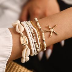 🐚Embrace Summer Vibes with our Bohemian Beach Bracelet Set!🐚 Channel your inner beach goddess with this stunning set of multilayer bracelets featuring bohemian rice beads, a delicate starfish pendant, and charming seashells. Each bracelet is handcrafted to bring a touch of ocean breeze to your everyday look. 🌊This set is perfect for: Summer adventures by the beach Adding a touch of bohemian flair to your everyday outfits Poolside parties and tropical getaways Layering with other bracelets for Summer Strand Beaded Bracelets With Starfish Charm, Summer Beachy Beaded Bracelets With Starfish Charm, Summer Beaded Strand Bracelets With Starfish Charm, Summer Beaded Bracelet With Starfish Charm, Summer Beaded Strand Bracelet With Starfish Charm, Summer Beachy Beaded Bracelet With Starfish Charm, Summer Vacation Beaded Bracelets With Starfish Shape, Handmade Charm Bracelet For Beach, Bohemian Beaded Charm Bracelet For Beach