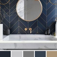 a bathroom with blue walls and gold accents