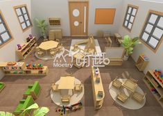 an aerial view of a classroom with tables, chairs and bookshelves on the floor