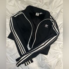 Like Brand New Adidas Cropped Zipped Sweatshirt White Zipper Closure Tops For Streetwear, Black Sporty Sweatshirt With Zipper, Adidas Half-zip Sports Top, Sporty Black Sweatshirt With Zipper Closure, Black Sporty Adidas Sweatshirt, Adidas Black Sweatshirt Sportswear, Black Sporty Sweatshirt With Zipper Closure, Adidas Crop Hoodie, Adidas Zne Hoodie