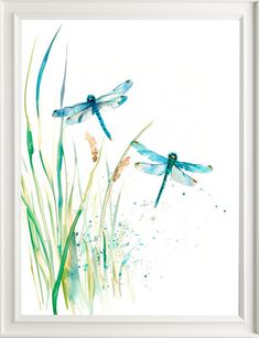 two blue dragonflies are flying in the air above tall grass and watercolor paint