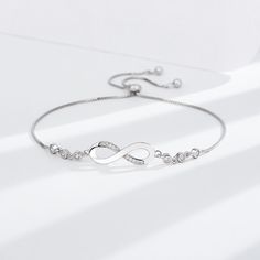 💎 Elevate Your Style with Sterling Silver: Choose the Silver-S925 option and experience the timeless beauty of the S925 Infinite Bracelet. Crafted from high-quality S925 sterling silver, this bracelet is not just jewelry; it's a symbol of everlasting connection and elegance. Classic Silver Infinity Jewelry, Silver Bracelet With Adjustable Chain For Anniversary, Timeless Sterling Silver Bracelets With Adjustable Chain, Elegant Sterling Silver Bangle Bracelet With Adjustable Chain, Classic Infinity Bracelets For Anniversary, Classic Adjustable Infinity Jewelry, Silver Adjustable Chain Bracelet For Anniversary, Adjustable Silver Chain Bracelet Fine Jewelry, Sterling Silver Bangle Chain Bracelet For Anniversary