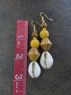 Bohemian Yellow Earrings For Beach, Brown Beaded Earrings For Beach With Dangling Beads, Brown Beaded Dangling Earrings For Beach, Brown Dangling Bead Earrings For Beach, Beach Wooden Bead Earrings, Handmade Brown Beaded Earrings For Beach, Handmade Yellow Beaded Earrings For Beach, Unique Yellow Jewelry For The Beach, Shell Jewelry With Wooden Beads