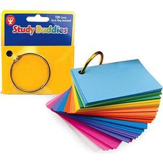 a pack of assorted colored paper with a gold ring