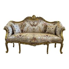 an ornately decorated couch with gold trimming