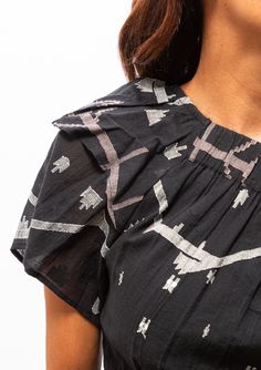 This cropped one shoulder top is a work of art. Inspired by Spain, this fabric motif shines on Mirth's take on a classic Indian design. Intricate hand-loomed Jamdani details make this an elegant classic to pair with their Paros skirt or Mirth pants. Across shoulder and waist are elastic for a perfect fit; can be worn bloused to show more skin, or straight to cover up. Jamdani is a special weave that takes great time and skill to master. the entire process happens without aid of modern technology Heritage Crafts, One Shoulder Top, One Shoulder Tops, Paros, Modern Technology, Hand Loom, Indian Design, Online Purchase, Blouse Designs