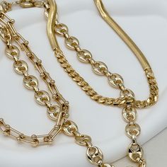 The Ryker Necklace, a timeless piece, embodies luxury and sophistication. Crafted from 18K gold filled materials, this 8mm bead link chain features a lustrous finish and a versatile 18-inch length with a 2" extender. Its refined elegance makes it a must-have for those who appreciate quality craftsmanship and style. Perfect for any occasion, it's sure to make a statement. 18" with 2" extension 18k gold filled demi-fine Luxury Refined Gold Necklace, Gold Medallion Necklace, Stacked Earrings, Gold Medallion, Bold Accessories, Ear Stack, Chunky Beads, Medallion Necklace, Gold Wood