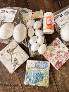 several different types of eggs in plastic bags on top of a wooden table with other items