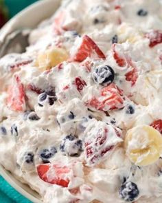 a white bowl filled with fruit salad on top of a table