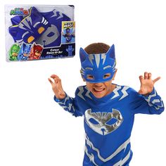 a young boy wearing a blue costume and mask with his hands up in the air