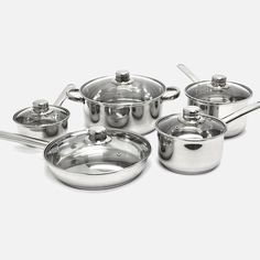 an assortment of pots and pans on a white background with the lids off to the side