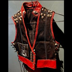 One-Of-A-Kind Custom Black Denim And Red Leather Studded Vest / Crop Top. Side Grommets And Black Leather Lacing For Corseted Or Loose Fit. Silver Skull Studs On Collar. Front Pocket With Brand Logo “Zotis” (Project Runway Designer.) Large Leather Spider Back Patch. Size Small/Medium. Perfect Rockwear / Stagewear. Punk Style Outfits, Leather Lacing, Statement Outfit, Vest Crop Top, Project Runway, Swaggy Outfits, Leather Vest, Lolita Fashion, Upcycle Clothes