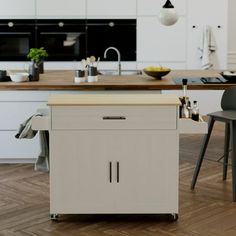 a kitchen with an island in the middle and two chairs on the other side,