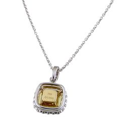 If you've always wanted to add yellow diamonds to your collection, then look no further. A square modified brilliant cut-cornered (radiant) 1.04 carat Natural Fancy Light Yellow Diamond with even color distribution is delicately set with four prongs in the center of this 18k white and yellow gold pendant. Smaller round yellow and colorless diamonds form a double tiered halo perimeter and cascade upwards towards the bail of this magnificent pendant which slides freely on an 18" long white gold ca Elegant Yellow Diamond Necklace For Anniversary, Elegant Yellow Rectangular Necklaces, Elegant Yellow Square Cut Jewelry, Yellow Gold Diamond Cut Square Pendant Jewelry, Elegant Yellow Rectangular Necklace, Unique Yellow Pendant Jewelry, Yellow Pendant Fine Jewelry, Yellow Pendant Necklace With Diamond Cut, Yellow Gold Diamond-cut Round Pendant Necklace