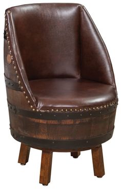 a wooden barrel chair with studded leather upholstered on the seat and legs