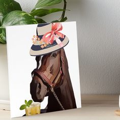 a brown horse wearing a hat with flowers on it's bridle art board print