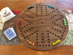 a wooden board game sitting on top of a table