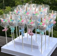 unicorn lollipops are lined up on a stick