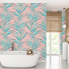 a bath tub sitting under a window next to a wallpapered bathroom with pink and blue leaves