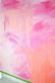 a pink and white painting on the wall