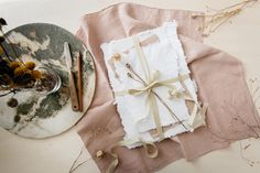 a table topped with a plate covered in cake next to a wrapped present