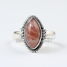 Natural Stone Ring, Real Rhodochrosite Ring, Sterling Ring, Pink Ring ,Boho Silver Ring , Statement Rings , Rhodochrosite Jewelry ----------------------------------------------------------------------------------------------------------------------------------------------------Metal: Solid 925 Sterling SilverStone Detail :Rhodochrosite Size- 6X12 mmShape- Marquise Cabochon Weight :  3.50  Gram Approx.------------------------------------------------------------------------------------------------ Handmade Bohemian Opal Ring For Healing, Bohemian Handmade Opal Healing Ring, Adjustable Bohemian Opal Ring, Rhodochrosite Ring, Rhodochrosite Jewelry, Purple Rings, Marquise Ring, Natural Gemstone Ring, Jewelry Metal