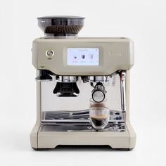 an espresso machine is shown on a white background