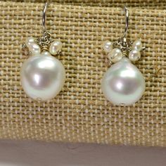 DESCRIPTION: Thank you for coming in! 14K solid white gold earrings with 11mm South Sea white baroque pearls and seed pearl accents! Full of luster and elegance! ! It looks much much nicer on your ears! You will receive the exact pair of earrings in the pictures! WEIGHT: 4.63 Grams LENGTH: 1 inch MATERIAL: 14K Solid White Gold, South Sea White Pearl, Seed Pearls Silver Dangle Pearl Earrings With High Luster, Briolette Pearl Charm Earrings For Weddings, Pear-shaped Pearl Charm Earrings In Fine Jewelry Style, Baroque Pearl White Earrings With Pearl Charm, Briolette Pearl Earrings, Pear-shaped White Gold Pearl Earrings, Pear-shaped Pearl Charm Earrings In White Gold, Baroque Pearl Earrings In Silver For Formal Occasions, Baroque Pearl Earrings In Silver For Formal Events