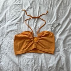 Urban Outfitters Crop Top Size Xl Nwt Color: Orange Self Tie Halter Neck Cheap Cotton Crop Top By Urban Outfitters, Affordable Orange Urban Outfitters Tops, Casual Orange Halter Top For Spring, Casual Orange Halter Top For Summer, Chic Orange Tops For Beach Season, Trendy Orange Tops From Urban Outfitters, Orange Cropped Top For Beach, Trendy Orange Urban Outfitters Top, Urban Outfitters Crop Top For Beach