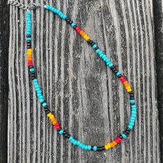 "ONE \"Virginia\" Beaded Choker in 16\", 14\" or 12\" length This hand-beaded choker is a perfect addition to any punchy outfit. Perfect for rodeo days. The pattern features turquoise and a serape/ sunset pattern. Includes an extension chain to ensure it fits most neck sizes comfortably. If you would like a different length, please message me! I would love to help you design your perfect necklace. I am more than happy to customize any order. Please feel free to ask me any questions and/or concer Adjustable Southwestern Turquoise Necklace For Festivals, Southwestern Adjustable Turquoise Necklace For Festivals, Adjustable Turquoise Necklace With Colorful Beads For Festival, Adjustable Beaded Turquoise Necklace For Festivals, Adjustable Multicolor Turquoise Necklace For Beach, Western Style Round Beads Jewelry For Festival, Western Style Blue Necklace For Festival, Adjustable Beaded Multicolor Turquoise Necklace, Adjustable Multicolor Beaded Turquoise Necklace