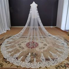 a white wedding veil on top of a rug