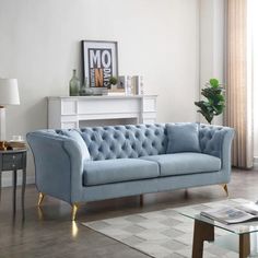 a living room with a blue couch and coffee table