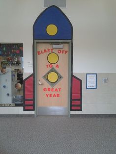 a door with an advertisement on it that says blast off to a great year