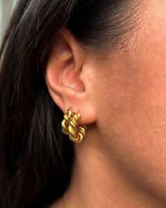 Inspired by the timeless vintage rope-style jewelries, the Celeste Earrings in this smaller version are lightweight semi-hoops for everyday staple. This twisted style dainty hoops is fastened by a standard post push-back closure. 18k Gold Coated Drop 0.6" Thickness: 4mm Hoop Earrings Standard post, Push-back Closure Hypoallergenic & non-tarnish Style Tips: The Celeste Earrings - Mini are gorgeous on their own but best paired with dainty classics such as the Antonetter Necklace & Antonette Bracel Dainty Hoop Earrings, Mini Twists, Versatile Jewelry, Stocking Fillers For Her, Forever Jewelry, Demi Fine Jewelry, Jewelry Ring Box, Mens Jewelry Bracelet, Style Tips