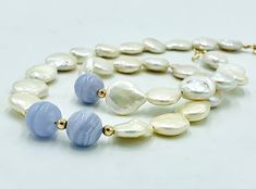 "* A lovely, luxurious Mother's Day Gift for someone special * Beautiful 14mm snow white Coin Pearls, with extremely high luster ( the pictures do not capture the true quality of these AA rated Pearls) * Equally lustrous 10mm Chalcedony Gemstone Beads, surrounded by 14K Gold Balls * The Necklace is finished with a 14K Gold Clasp * This Necklace is available in any length you prefer, up to 20\"; just add a note at checkout with your preference * Gift wrap is included Thank you for visiting my sho Blue Wedding Jewelry, Teardrop Bridal Earrings, Bridal Statement Earrings, Natural Pearl Necklace, Coin Pearls, Bridesmaid Bracelet, Natural Pearl, Wedding Jewelry Sets, Bridal Jewelry Sets