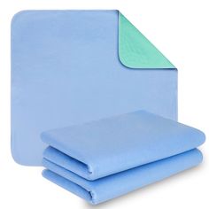 three blue sheets stacked on top of each other with one folded up and the other folded down