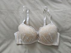 A NWT old stock Vintage Bra from Japan, in size 12B/Aus, 34B/UK and 34B/US, (D75 Japan) (see sizing chart in pictures) in a white net and lace finish with contrasting underlay. Underwired with elasticised, removable and adjustable straps and double clasp with removable padded cups. Has matching satin bow between cups. Colour - White Vintage Bra, Bra Items, Satin Bow, Bra Lingerie, Sizing Chart, Favorite Outfit, Adjustable Straps, Bathing Beauties, Lingerie