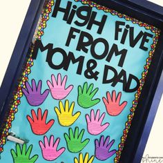 a sign that says high five from mom and dad with handprints on it