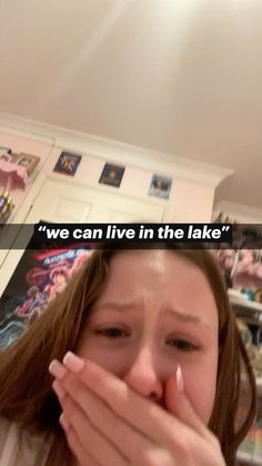 a woman covering her mouth with both hands and saying we can live in the lake