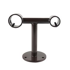 a black metal stand with two circular mirrors on it's sides and an eyeball in the middle