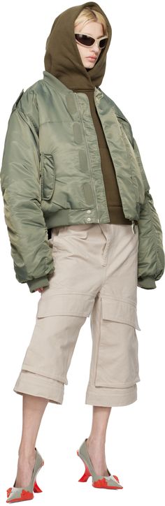 Insulated nylon taffeta bomber jacket. · Rib knit band collar, hem, and cuffs · Zip closure with velcro placket · Zip pocket and flap pockets · Epaulets · Dropped shoulders · Utility pocket at sleeve · Welt pockets at interior · Full satin lining Wholesale exclusivity at SSENSE. Supplier color: Swamp Nylon Techwear Outerwear With Ribbed Cuffs, Nylon Outerwear With Pockets And Stand Collar, Nylon Outerwear With Zip Cuffs For Streetwear, Nylon Outerwear With Ribbed Cuffs For Streetwear, Fall Nylon Outerwear With Cargo Pockets, Fall Nylon Outerwear With Flap Pockets, Winter Nylon Outerwear With Cargo Pockets, Hooded Outerwear With Elastic Cuffs For Streetwear, Urban Outerwear With Stand Collar And Ribbed Cuffs