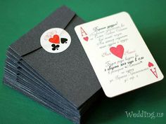 a stack of cards with playing cards attached to the front and back of each card