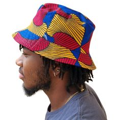 A unisex bucket cap made using authentic Ankara fabric. 58cm. Ankara, also known as African wax print or Dutch wax print, is a fabric characterized by vibrant patterns and colors. The fabric is made through a wax-resist dyeing technique called batik which creates distinct and colorful patterns. Ankara fabric is used to make a wide range of clothing and accessories, including dresses, skirts, shirts, and hats. Each pattern carries cultural meanings and stories making pieces made from this fabric not just fashion items but also carriers of African heritage and identity. Casual Multicolor Cotton Sun Hat, Multicolor Cotton Bucket Hat, One Size, Multicolor Cotton Bucket Hat, One Size Fits Most, Casual Multicolor Cotton Bucket Hat, Multicolor Reversible Cotton Sun Hat, Multicolor Reversible Cotton Bucket Hat, Reversible Multicolor Cotton Sun Hat, Reversible Multicolor Cotton Bucket Hat, Multicolor 5-panel Beach Hat