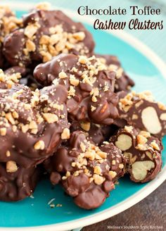 chocolate toffee cashew clusters on a blue plate