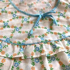 This vintage night gown is in excellent condition considering its age. The bodice features a frill and the blue and orange trellis design could not be prettier.  The label is very faded but I can make out 40 which is the equivalent of a UK size 12 however I am listing the full measurements are below to be sure; Length (shoulder to hem) 49 1/2in / 126cm Chest - 101cm / 39 3/4 inches I normally send my parcels using Mondial Relay Tracked courier service however for France only, if the item is fabric, I could use La Poste. This would be a standard lettre verte service. Please contact me prior to purchase if you would like to use La Poste and I can confirm the price. Please check out my other items Thanks for visiting Stones Online Boutique :) Vintage Dresses For Pajama Party, Vintage Blue Dress For Sleepover, Vintage Nightgown With Ruffles For Loungewear, Vintage Blue Sleepwear For Pajama Party, Vintage Ruffled Sleepwear For Summer, Vintage Ruffled Nightgown For Sleepovers, Vintage Ruffled Sleepwear For Spring, Vintage Ruffled Nightgown For Loungewear, Retro Lace Trim Nightgown For Sleep