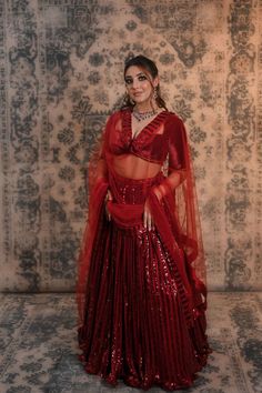 Power up your wardrobe collection with this maroon colour sequins work lehenga Ever thought of trying something different and appealing, this maroon coloured lehenga in sequined work can be a win-win choice for you. It comes along with a low-cut neckline silk velvet blouse which is decorated with bead tassels that will add a lot of oomph to your look. This amazing and stylish lehenga is designed keeping in mind your comfort and style statement. You must have heard that a lehenga is incomplete wi Sequins Lehenga, Stylish Lehenga, Bead Tassels, Maroon Colour, Work Lehenga, Velvet Blouse, Velvet Blouses, Something Different, Maroon Color